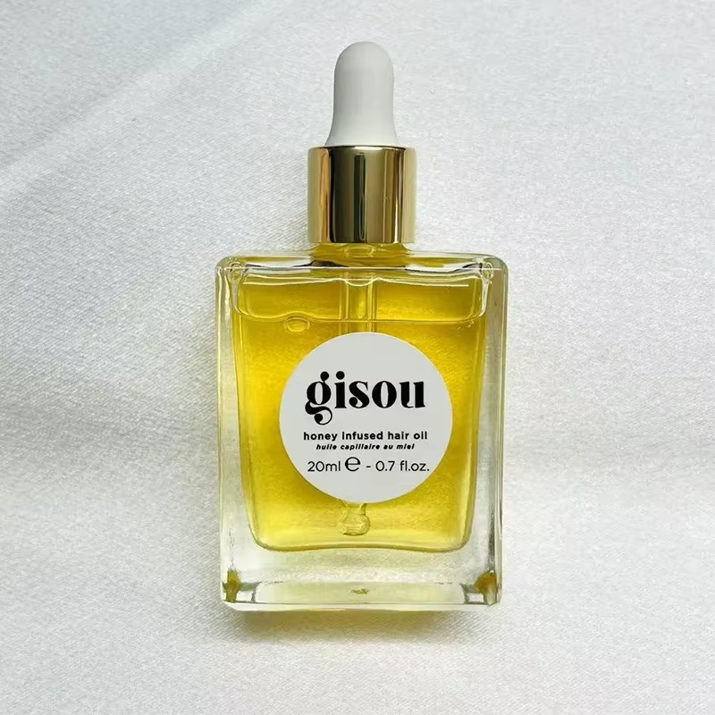 Huile capillaire infusée au miel Gisou : Soin pour cheveux secs, flexibilité essentielle, douceur lo
