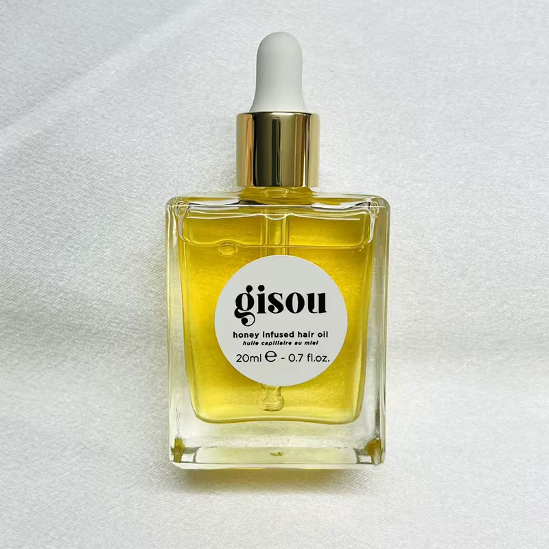Nouvelle huile capillaire infusée au miel Gisou améliore les soins des cheveux secs, flexibilité ess