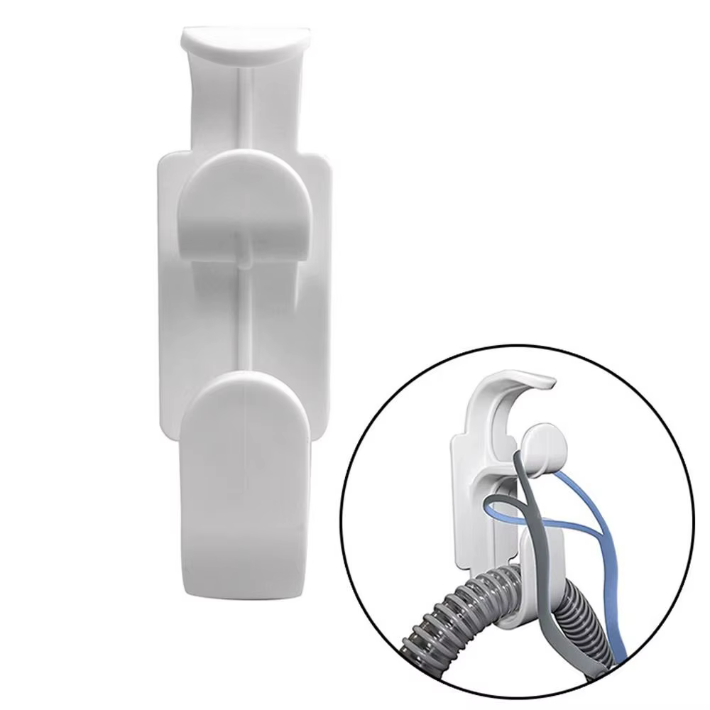 Le cintre de support de tuyau CPAP pour le lit, le mur, le support de masque et le crochet de tuyau empêche l'enchevêtrement de tuyau