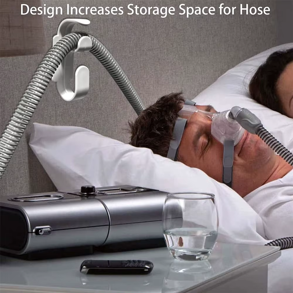 Le cintre de support de tuyau CPAP pour le lit, le mur, le support de masque et le crochet de tuyau empêche l'enchevêtrement de tuyau