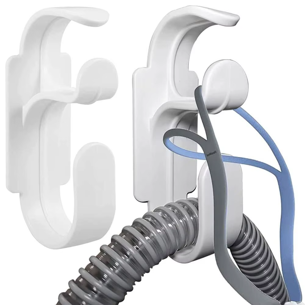 Le cintre de support de tuyau CPAP pour le lit, le mur, le support de masque et le crochet de tuyau empêche l'enchevêtrement de tuyau